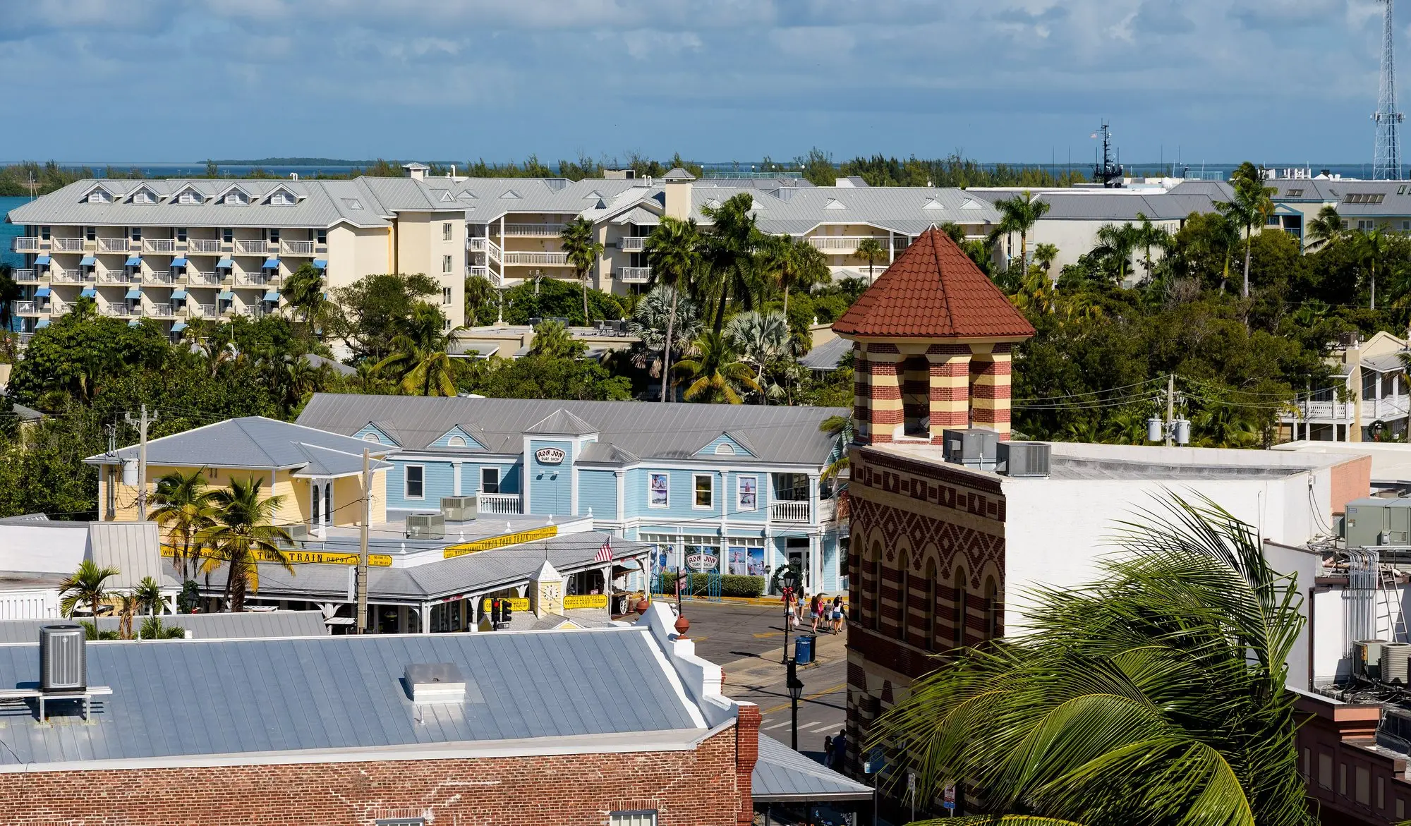 Rooftops, palms and pastel buildings near Front and Duval Street in Key West