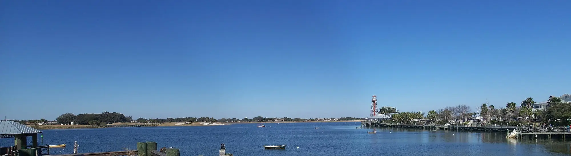Waterfront at Lake Sumter Landing in The Villages with a lighthouse and boardwalk